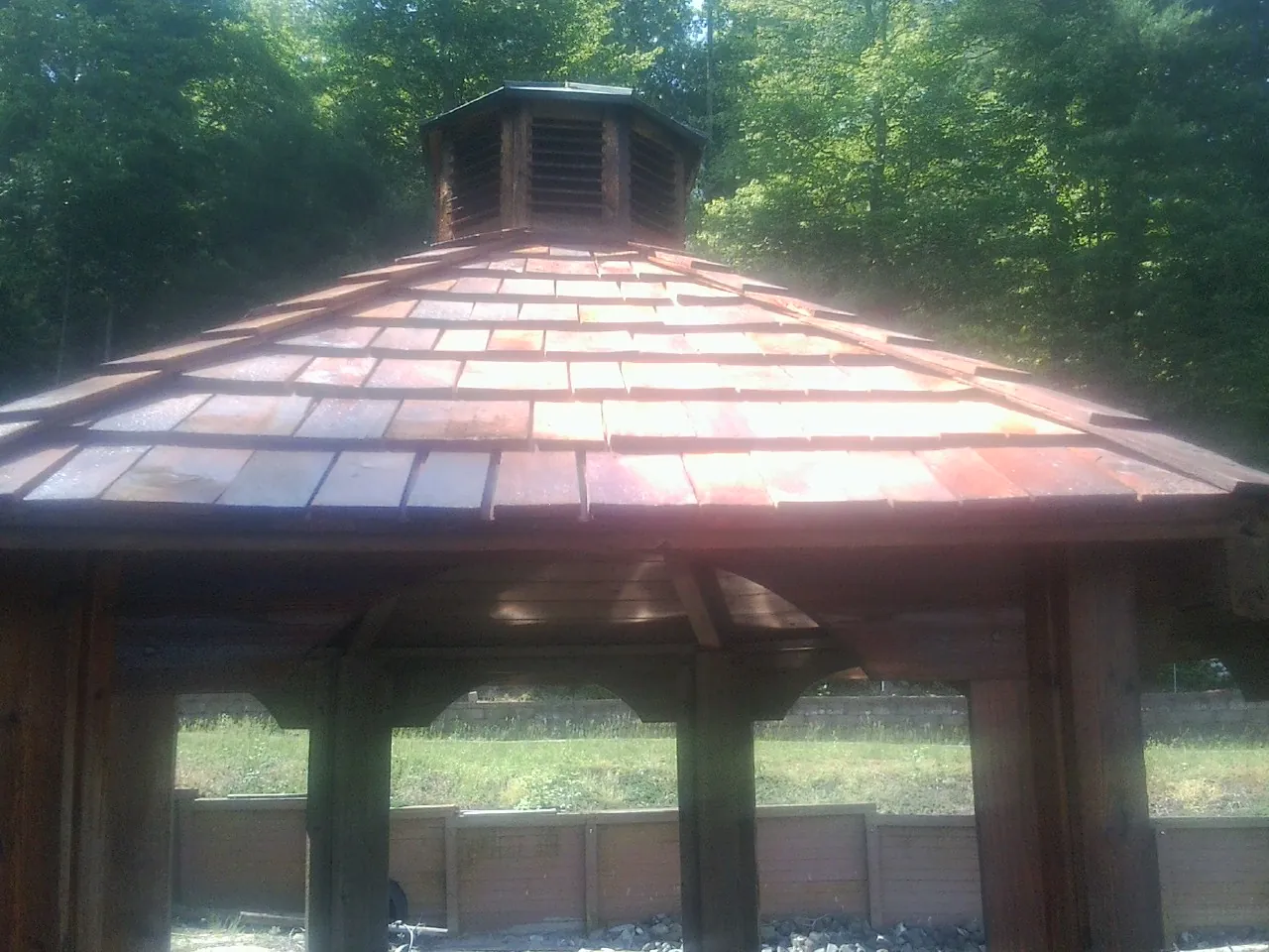 New cedar shake roof and cupola on a lakeside gazebo in South Hackensack